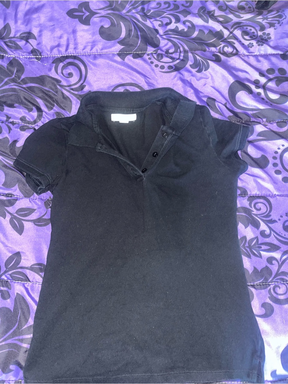 Women’s black polo top